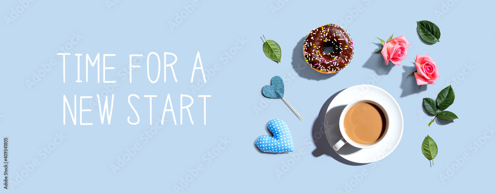 Time for a new start message with a cup of coffee and a donut - flat lay