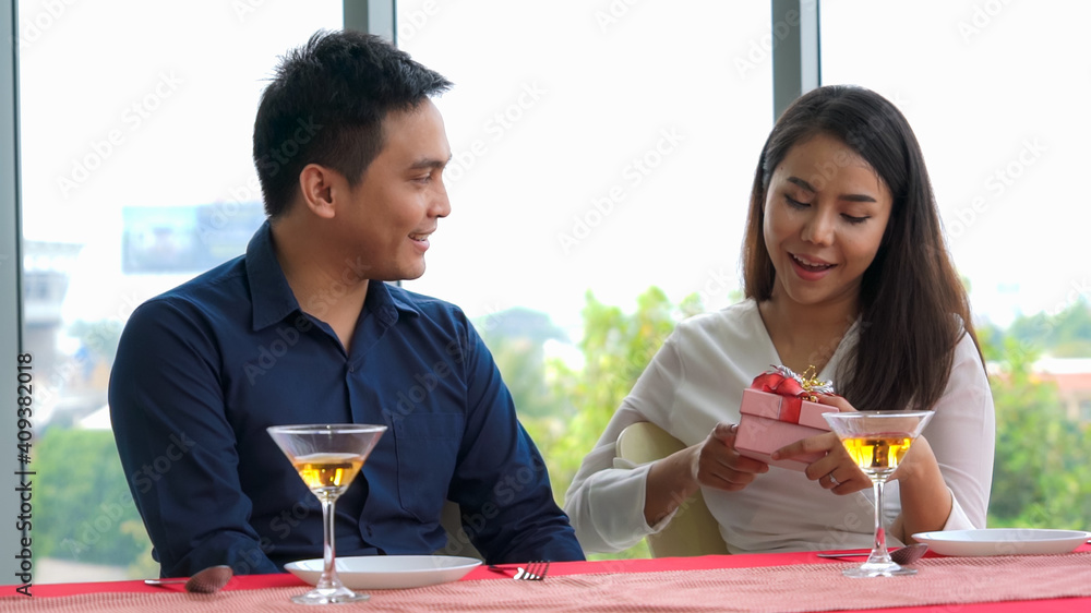 Happy romantic couple eating lunch at restaurant . Couple anniversary celebration and lifestyle .