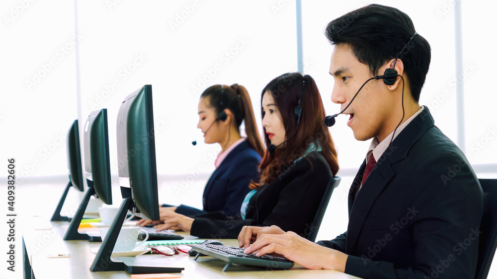 Business people wearing headset working in office to support remote customer or colleague. Call cent