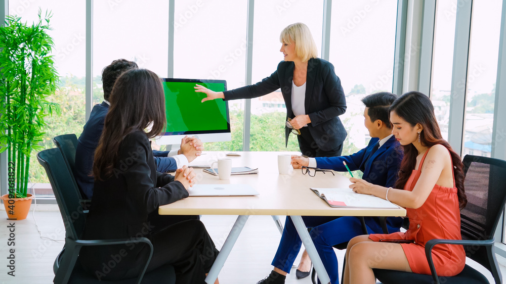 Business people in the conference room with green screen chroma key TV or computer on the office tab