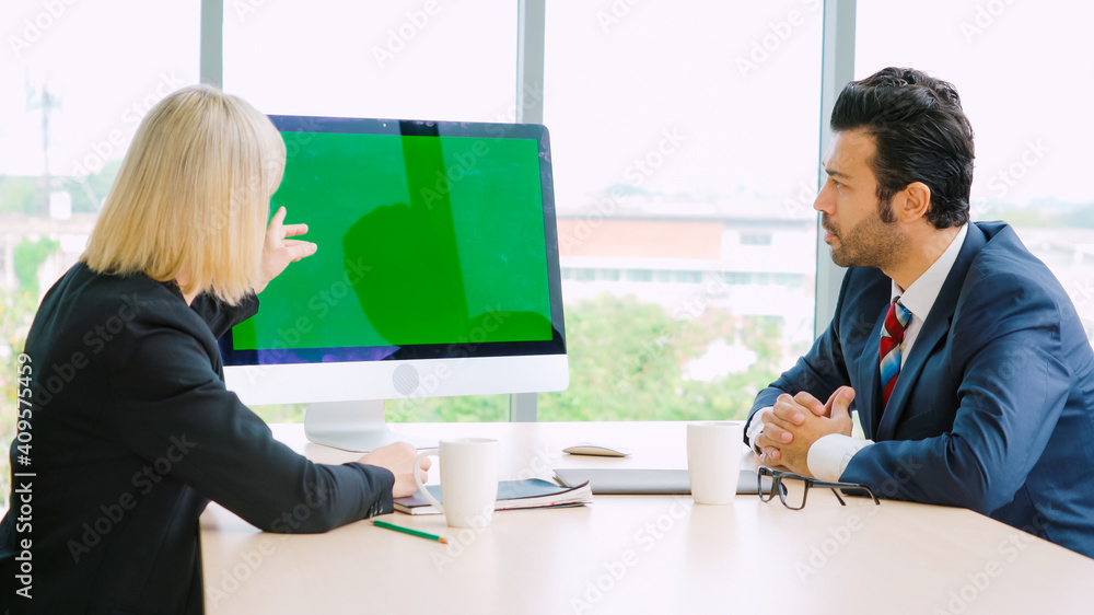 Business people in the conference room with green screen chroma key TV or computer on the office tab