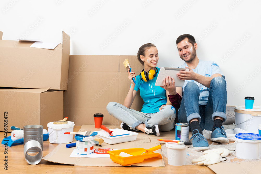 Couple watching something funny on tablet computer