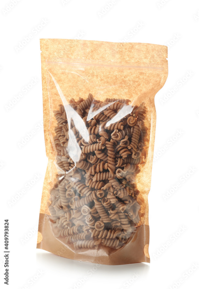 Paper bag with pasta on white background