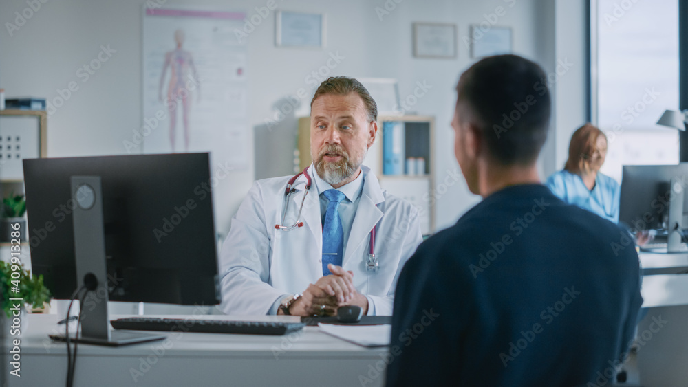 Family Doctor is Delivering Great News About Male Patients Medical Results During Consultation in a