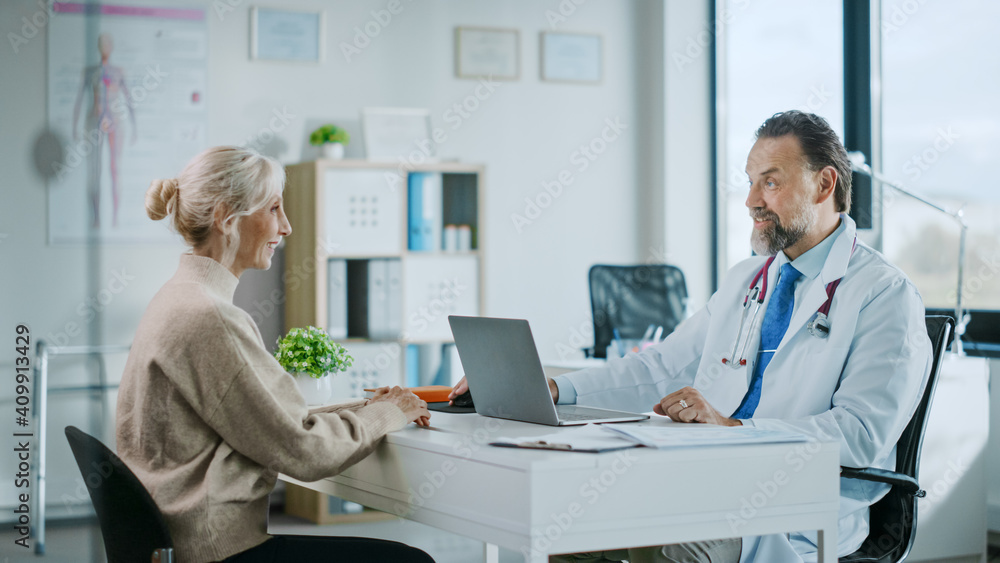 Friendly and Cheerful Family Doctor is Reading Medical History of Senior Female Patient During Consu