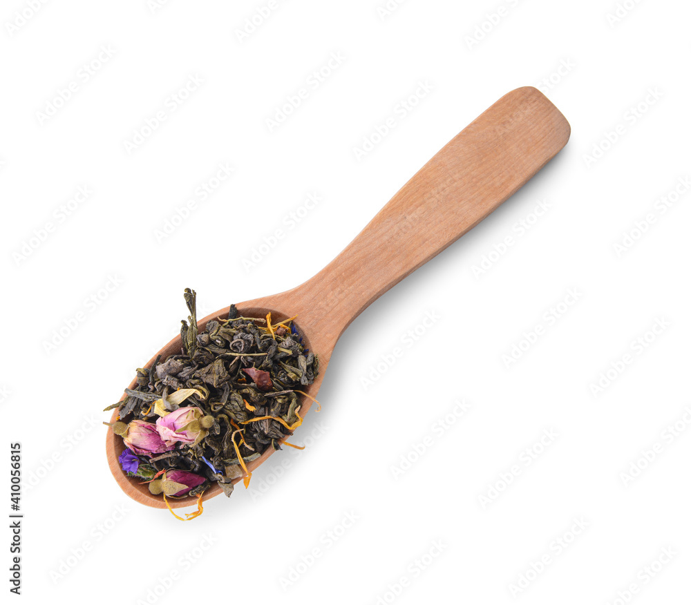 Wooden spoon with dry tea leaves and flowers on white background