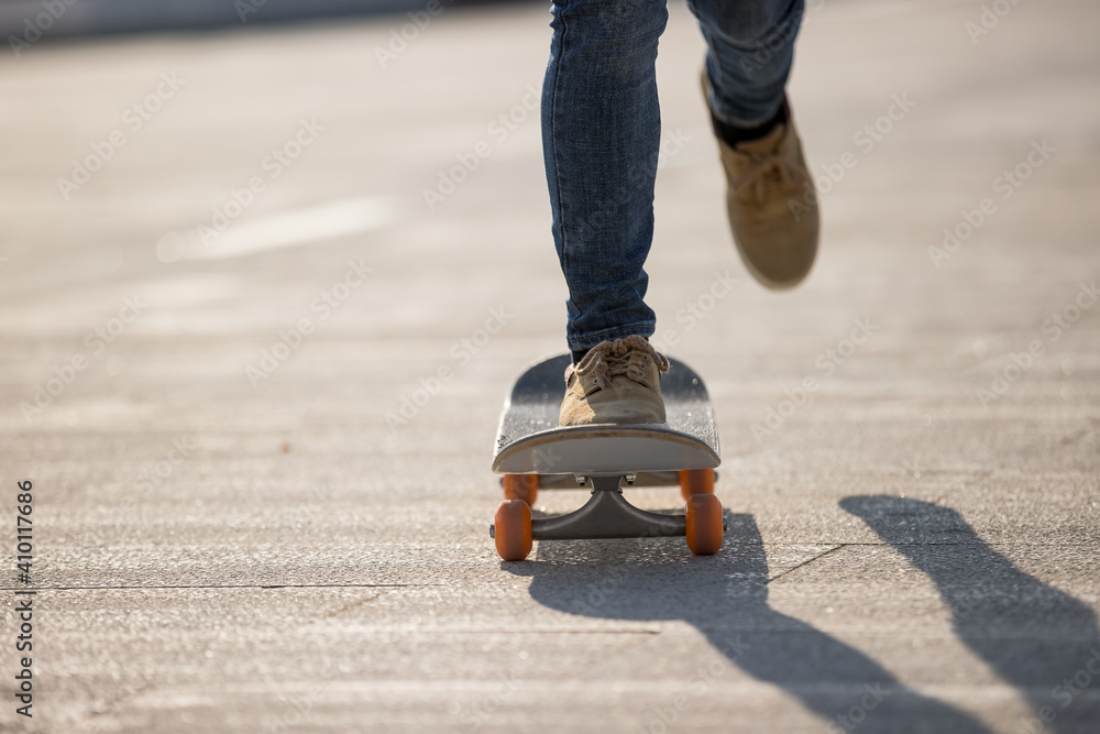 Skateboarder skateboarding outdoors on sunny morning