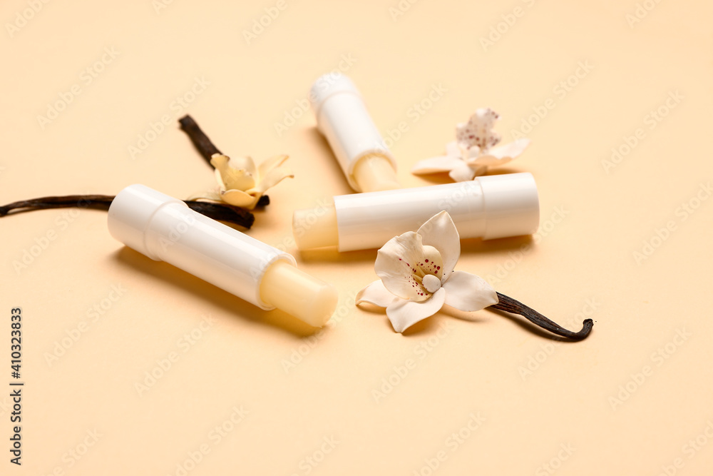 Natural lip balms with vanilla on color background