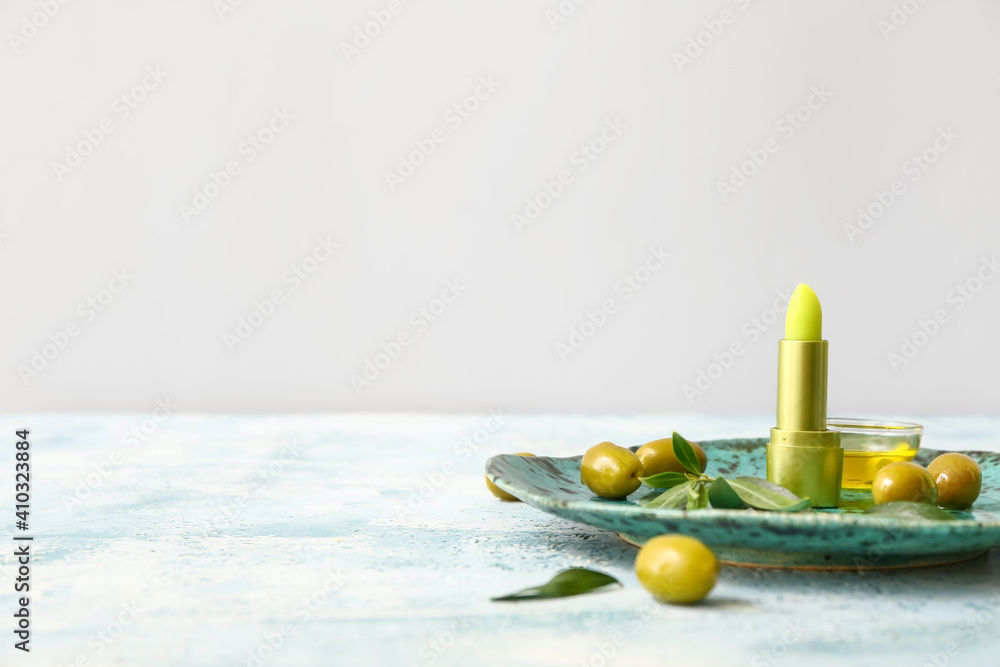 Natural lip balm with olive oil on table