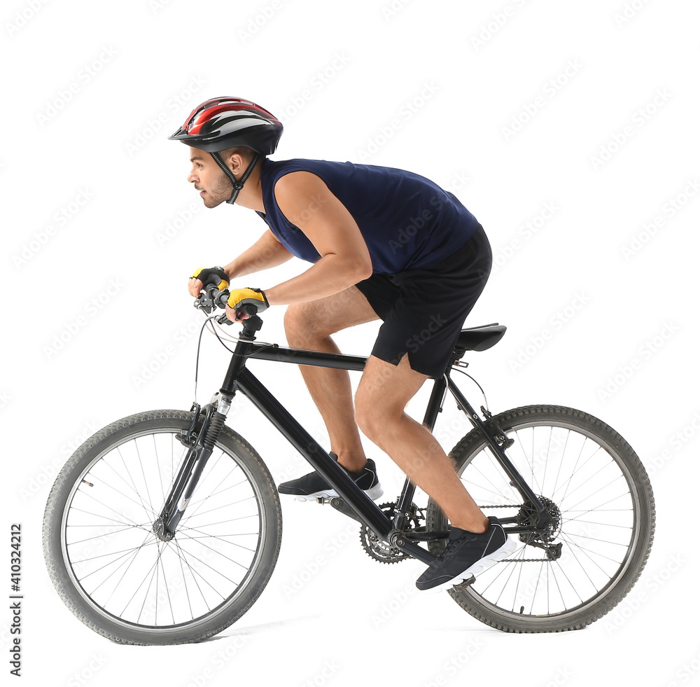 Male cyclist riding bicycle on white background