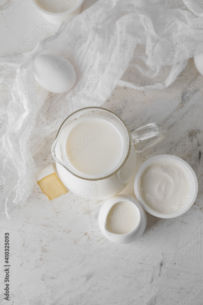 Different dairy products on light background