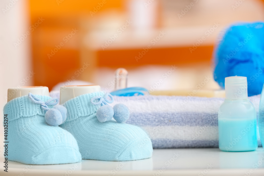 Different bath accessories for baby on table