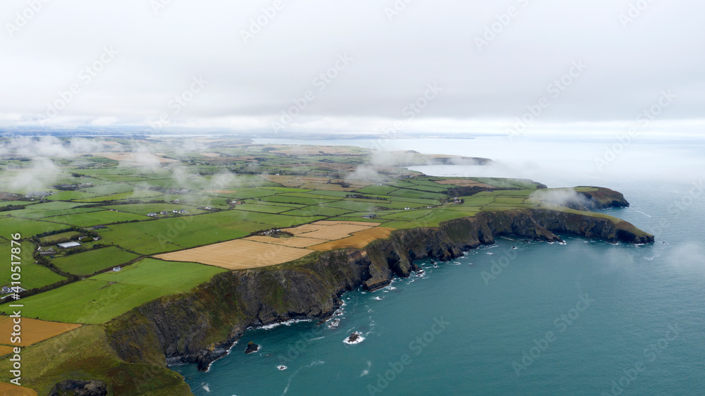 Clouds sweeping across the land at Nohoval Cove in County Cork, Ireland