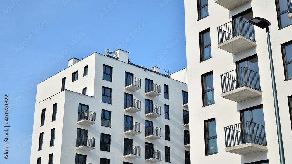 Modern apartment building in sunny day. Exterior, residential house facade.