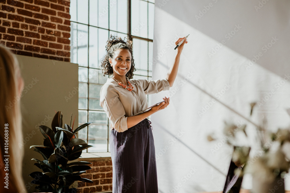 Woman presenting in a meeting