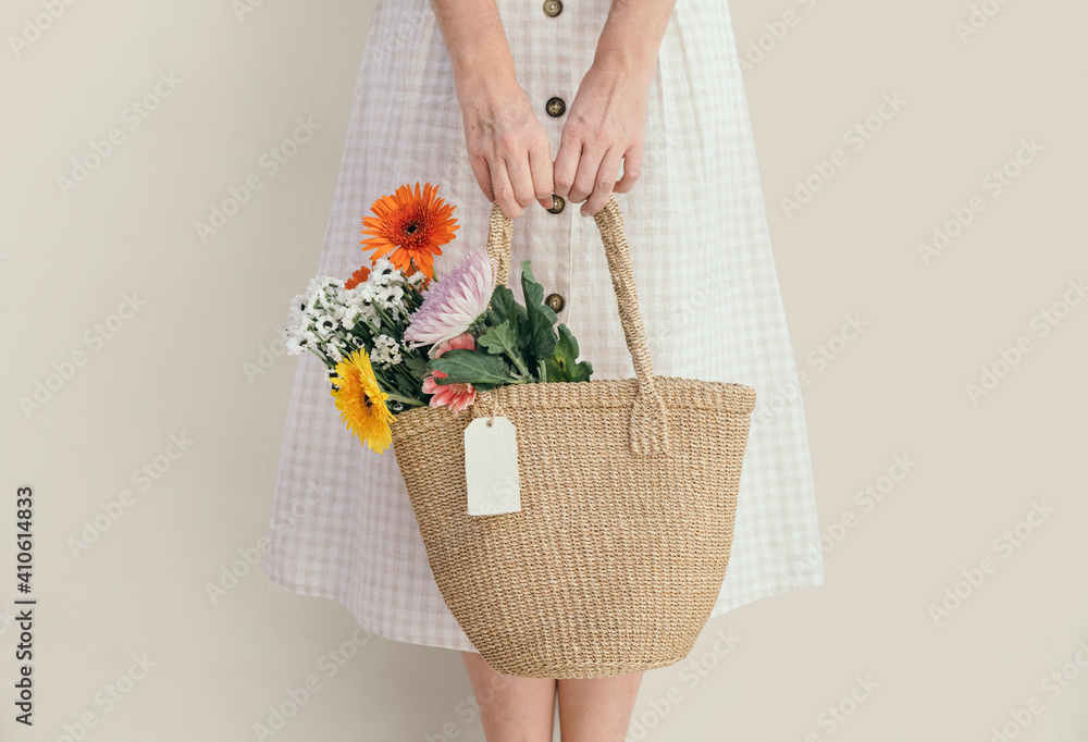 Woman with a bag of flowers