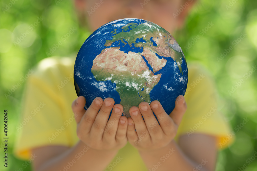 Child holding Earth planet in hands