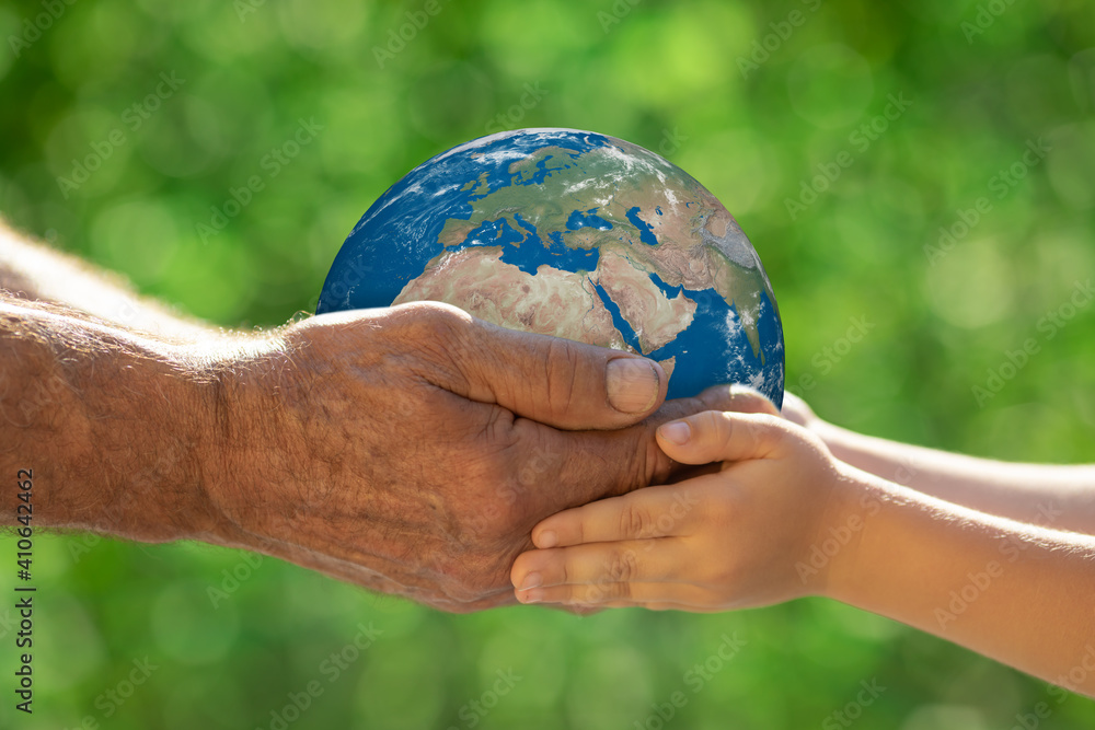 Family holding 3d planet in hands. Earth day spring holiday concept. Elements of this image furnishe