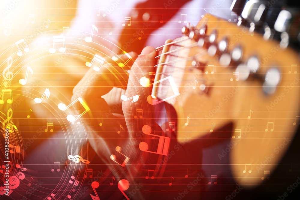 Man playing guitar, closeup view