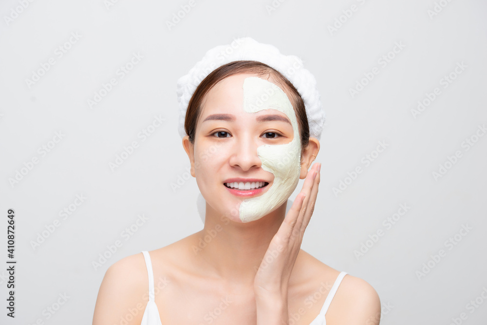 Beauty Face Care. Portrait Of Young Asain Girl Touching Her Perfect Soft Facial Skin. Over white bac