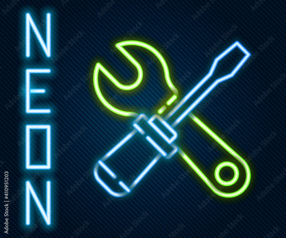 Glowing neon line Screwdriver and wrench spanner tools icon isolated on black background. Service to