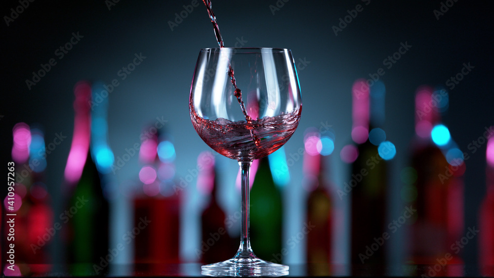 Pouring red wine into glass