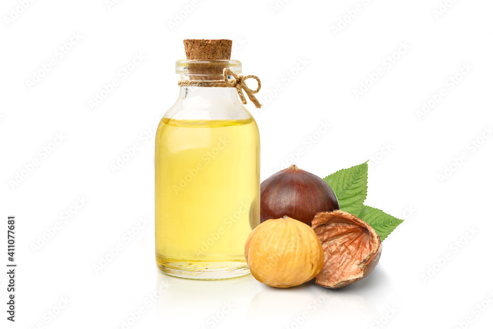 Chestnut oil with seed and leaves isolated on white background.