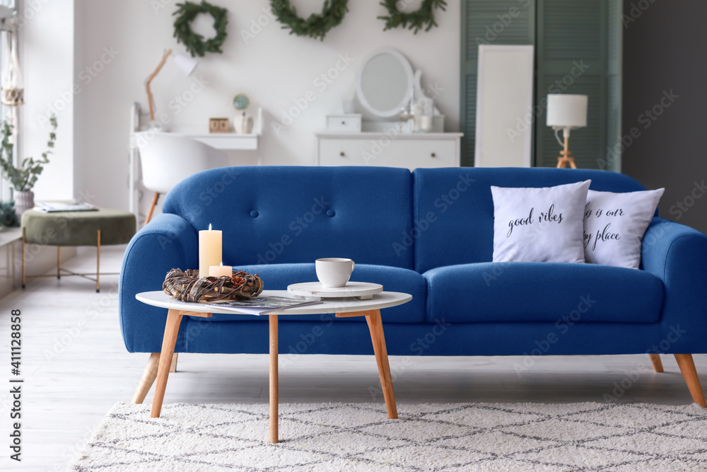 Interior of modern living room with blue sofa