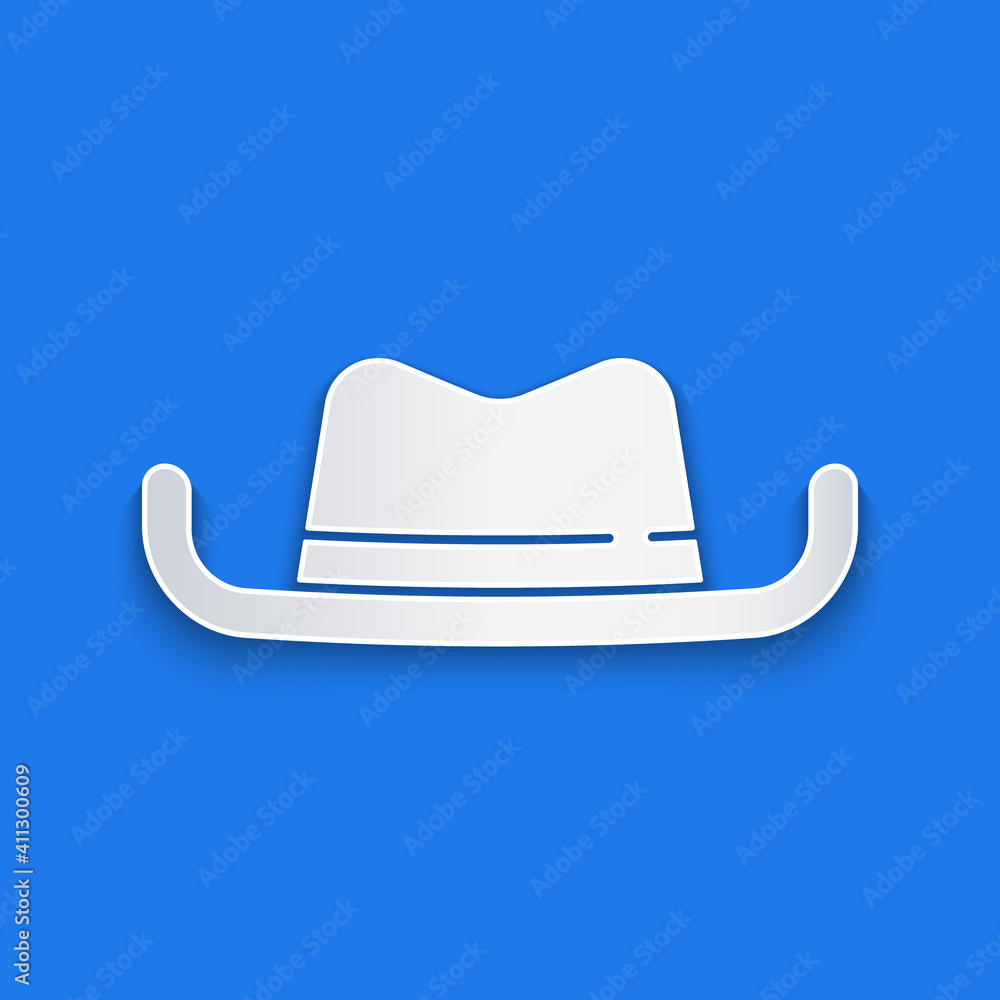 Paper cut Western cowboy hat icon isolated on blue background. Paper art style. Vector.