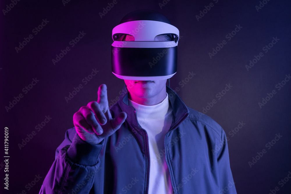 Man with VR headset pressing on an invisible screen