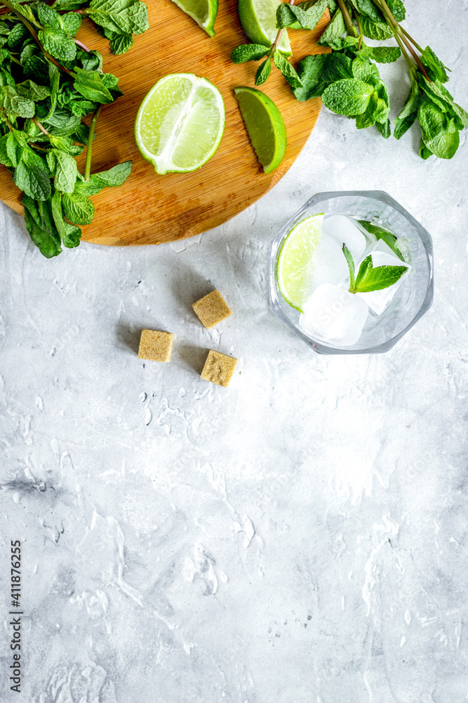 making mojito on stone background top view