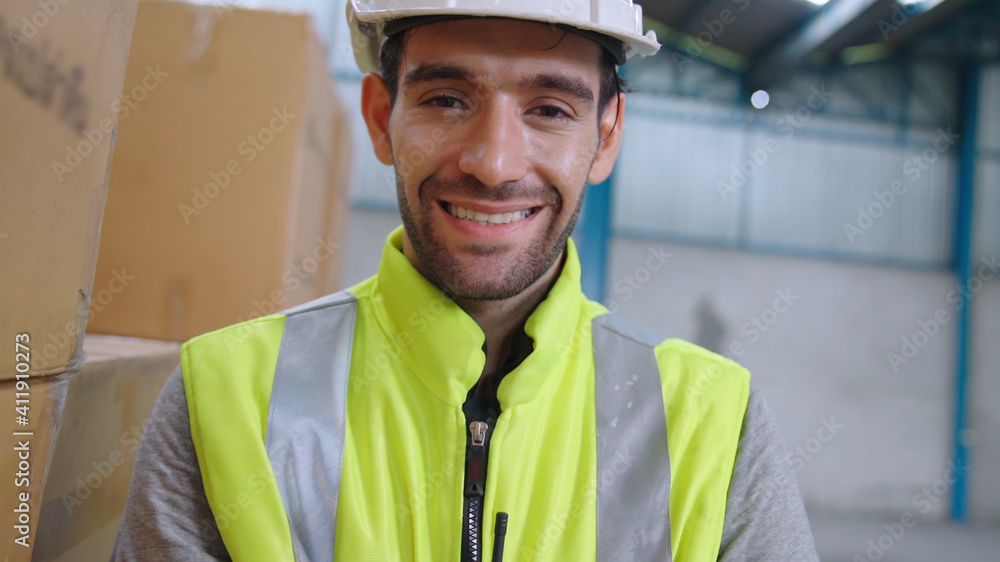 Professional industry worker close up portrait in the factory or warehouse . Production line operato