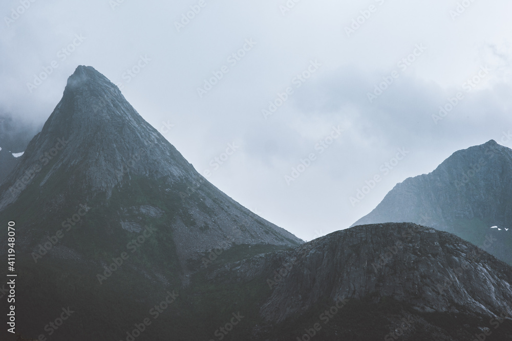 Foggy mountain peak landscape in Norway dark rocks scenery travel wilderness nature