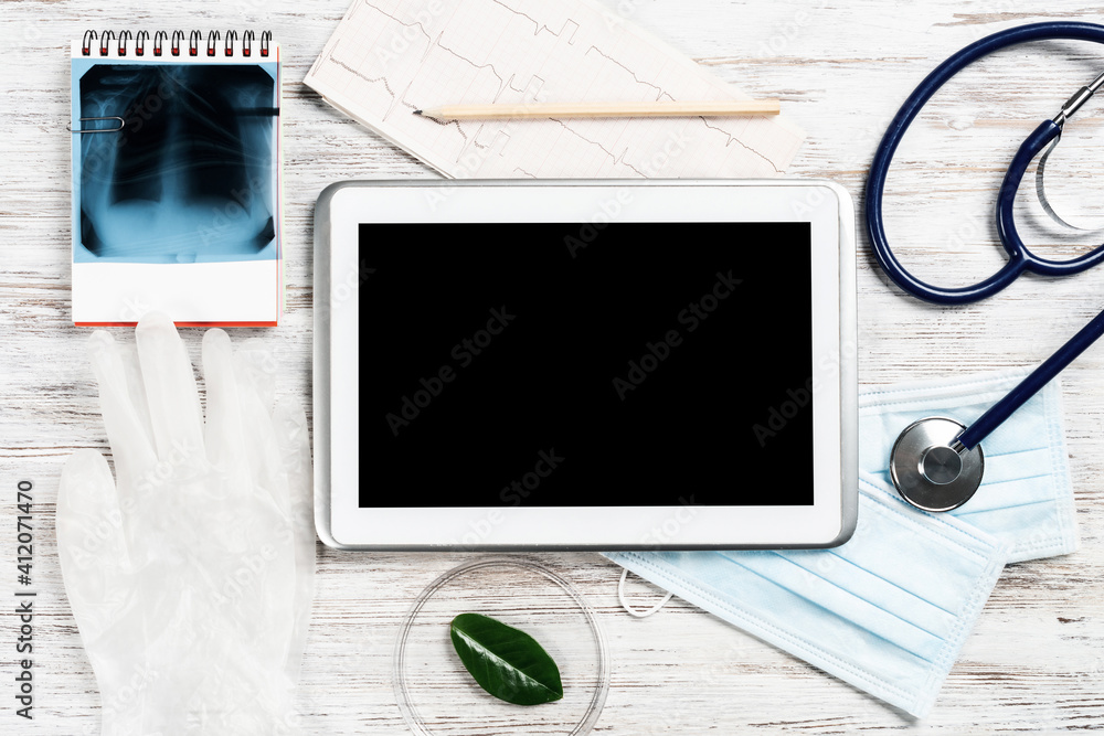 Mock up of doctors desktop with medical supplies