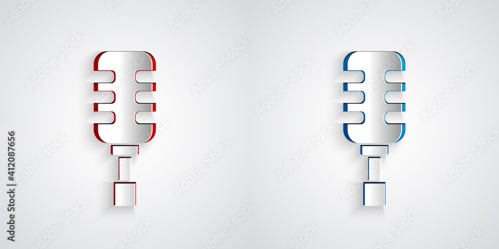灰色背景上隔离的剪纸麦克风图标。空中广播麦克风。扬声器符号。Pa