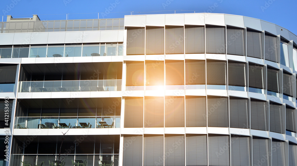 A residential building and an adjacent office building. Modern urban development. Buildings against 