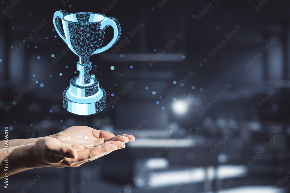 Award concept with polygonal winner trophy cup above man hand at abstract dark background.