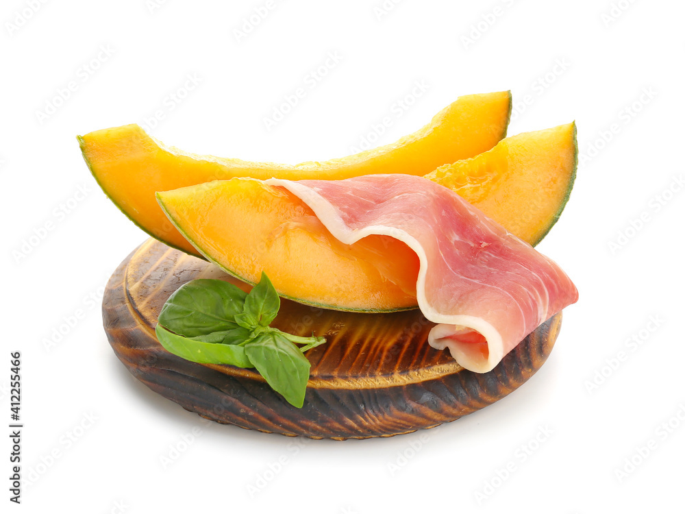 Board with delicious melon and prosciutto on white background