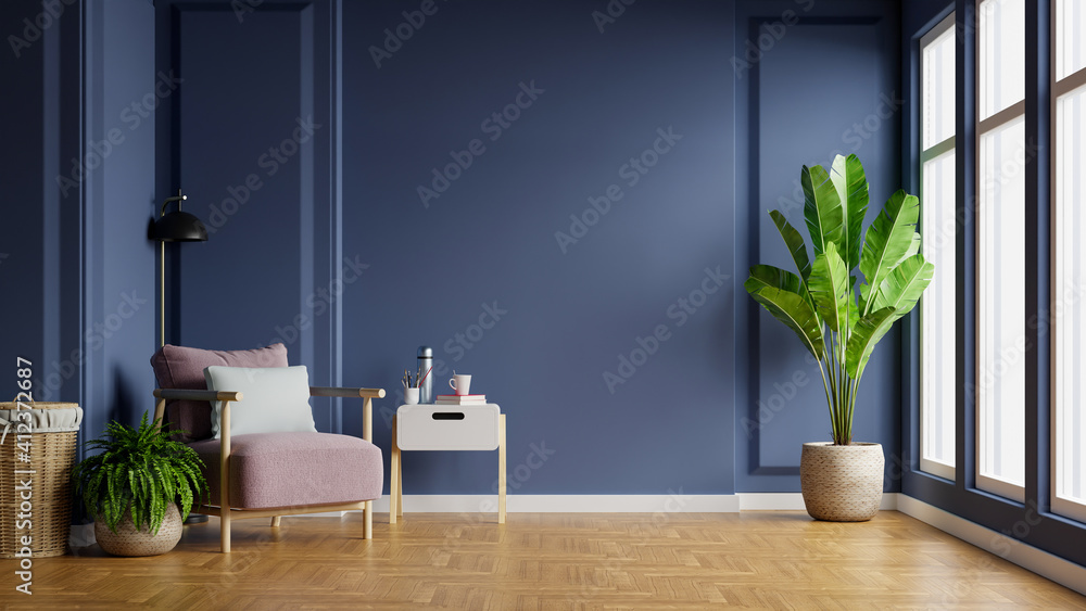 Interior of light room with armchair on empty dark blue wall background.