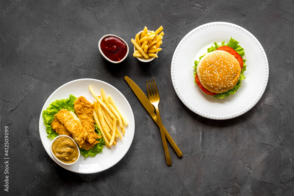 Overhead view of fast food - burger and french fries, flat lay