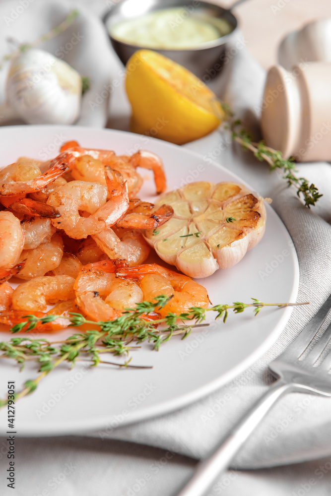 Plate with tasty shrimps on table, closeup