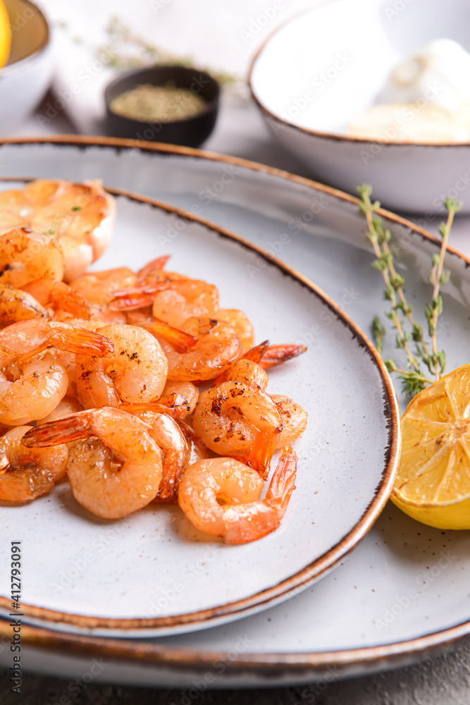 Plate with tasty shrimps on table, closeup