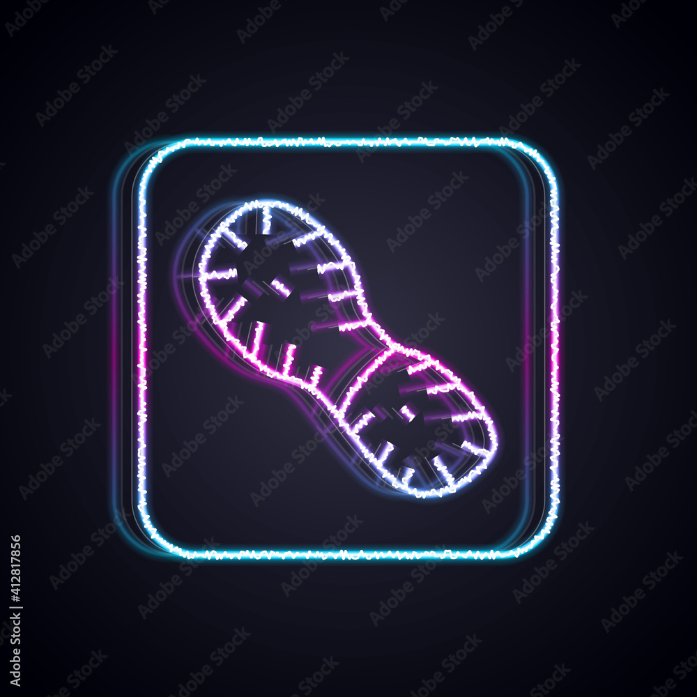 Glowing neon line Human footprints shoes icon isolated on black background. Shoes sole. Vector.