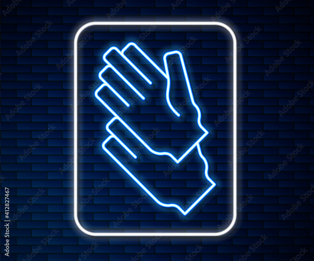 Glowing neon line Rubber gloves icon isolated on brick wall background. Latex hand protection sign. 