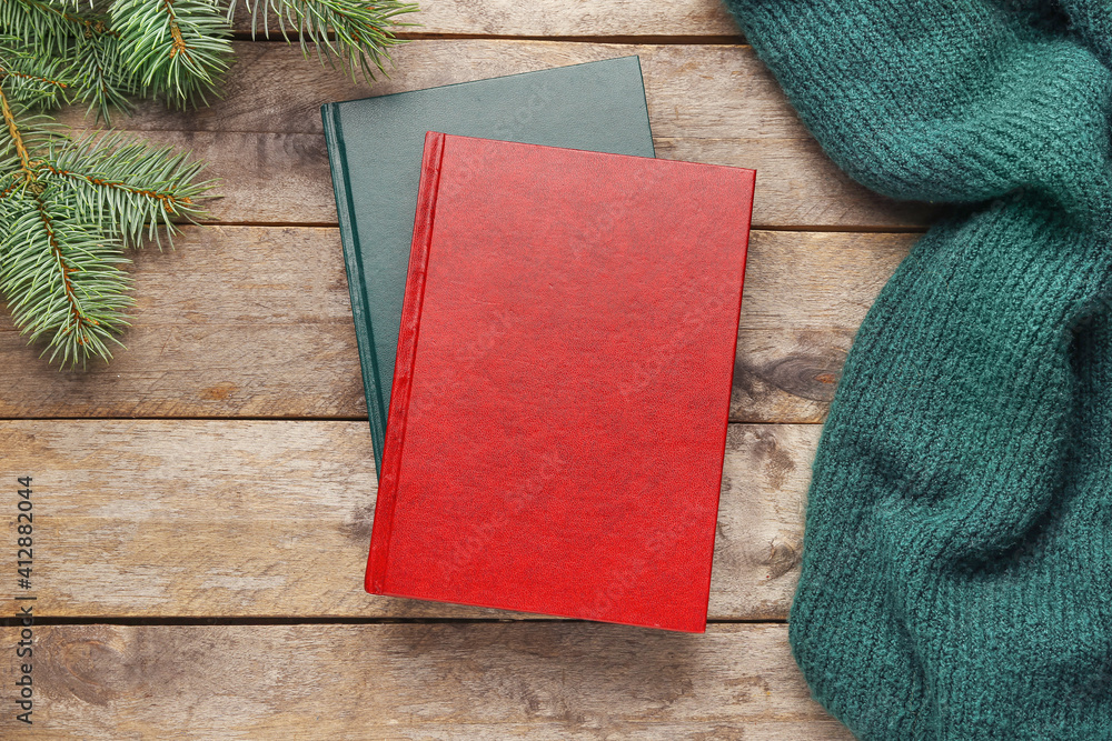 Christmas composition with blank books on wooden background