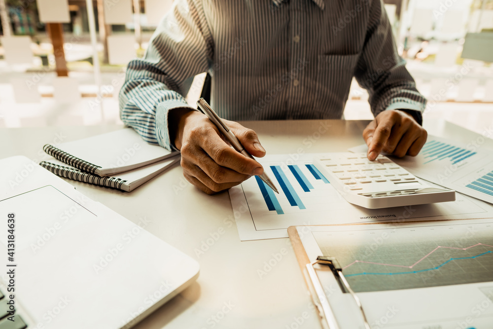 Businessmen or accountants are taking notes and calculating their budgets. Finance and accounting co