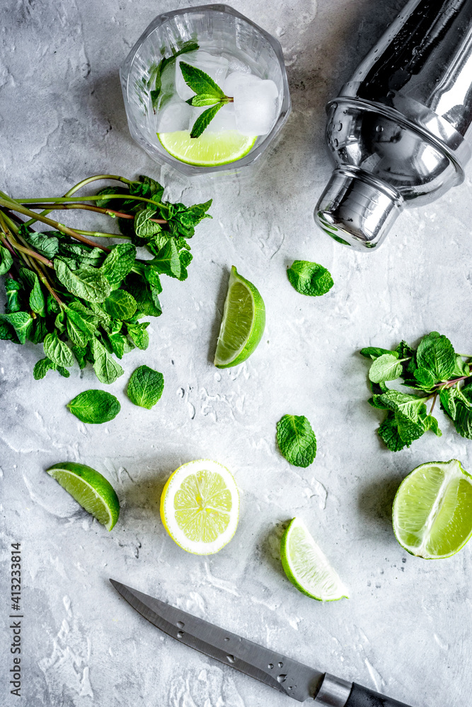 making mojito on stone background top view