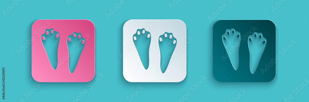 Paper cut Rabbit and hare paw footprint icon isolated on blue background. Paper art style. Vector.