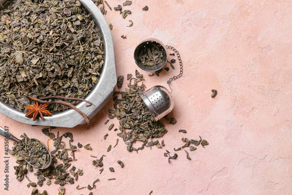 Dish with dry tea leaves on color background