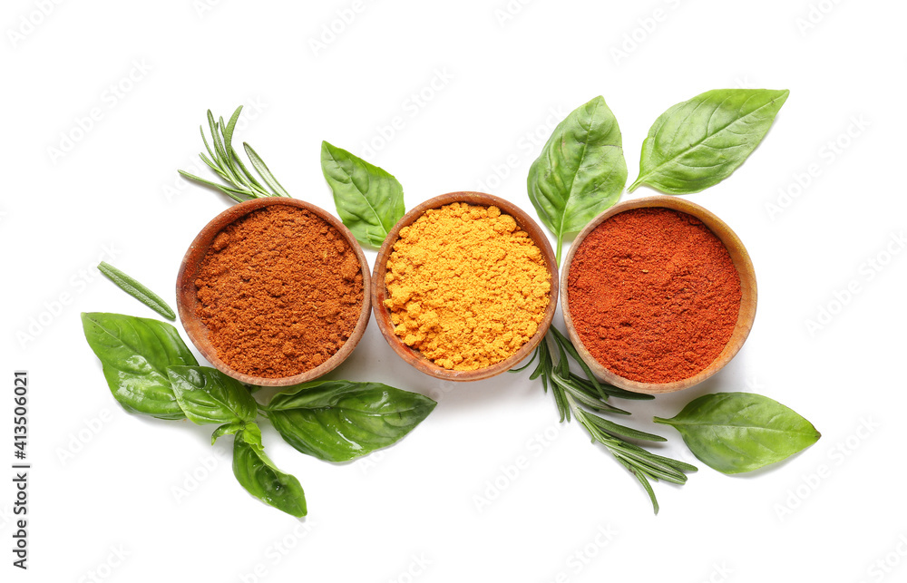 Bowls with different spices and herbs on white background